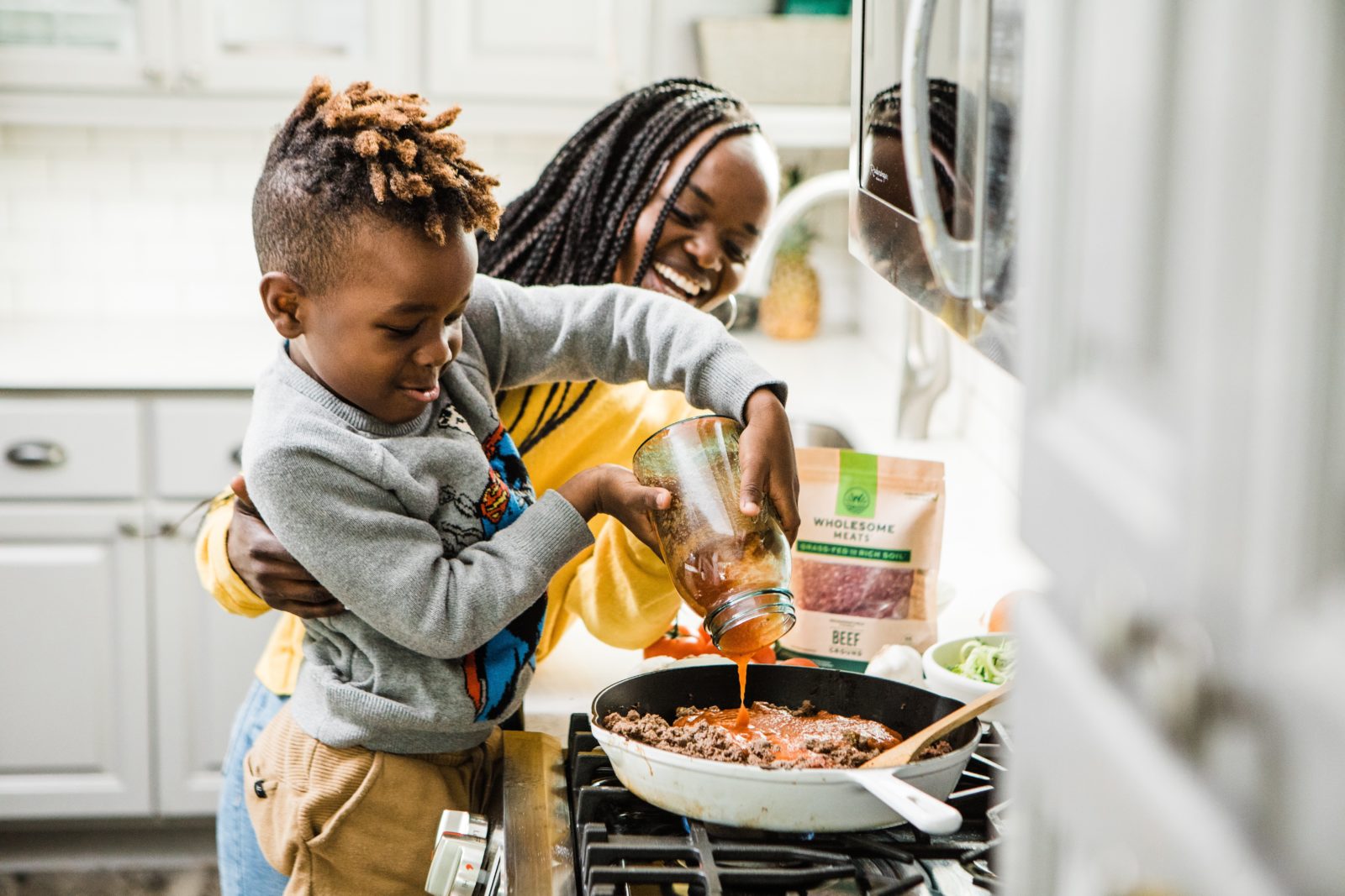 Mother and Child prep dinner together.